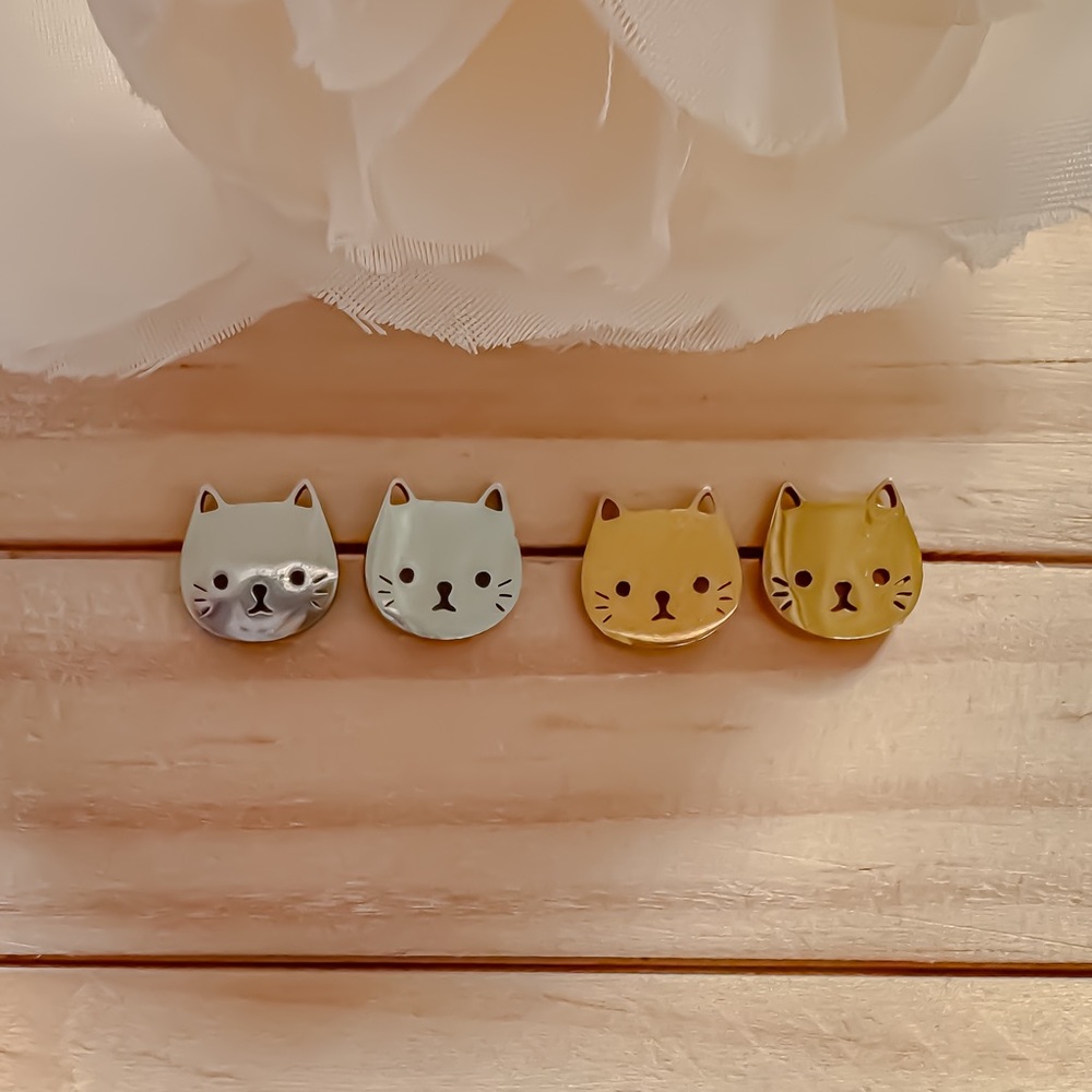 Cat stud earrings in surgical stainless steel.